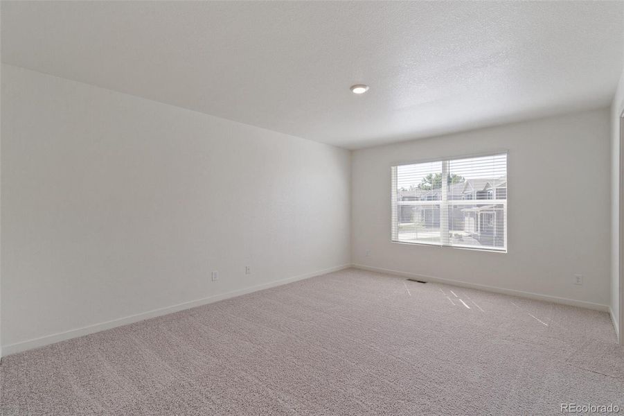 Spacious, unfurnished interior of a new home in Trails at Crowfoot, Parker (Image 21).