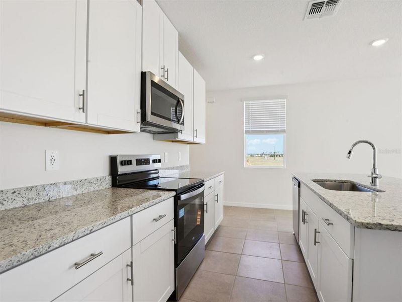 Furnished interior view inside a new home in Oakfield Trails - Premier Series, Parrish (Image 7).