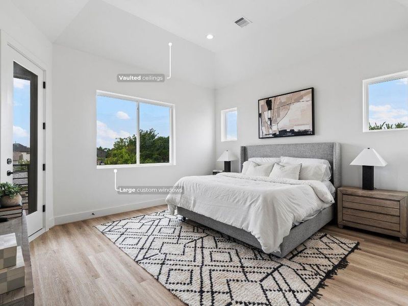 The primary bedroom features vaulted ceilings, a private door leading to your own covered patio, and a large window with a beautiful view to wake up to.