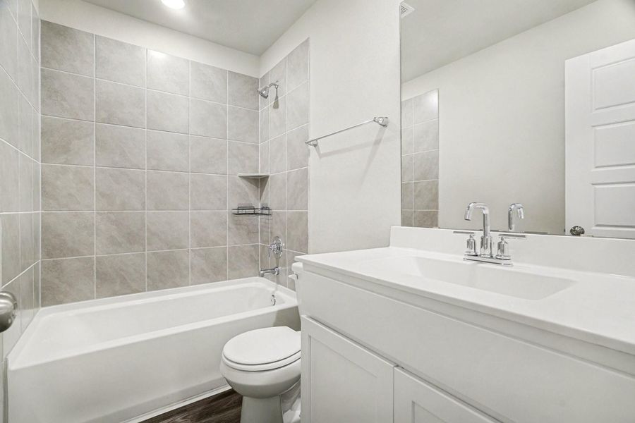 Secondary bathroom off the secondary bedrooms with a combination tub and shower. Secondary bathroom off the secondary bedrooms with a combination tub and shower.