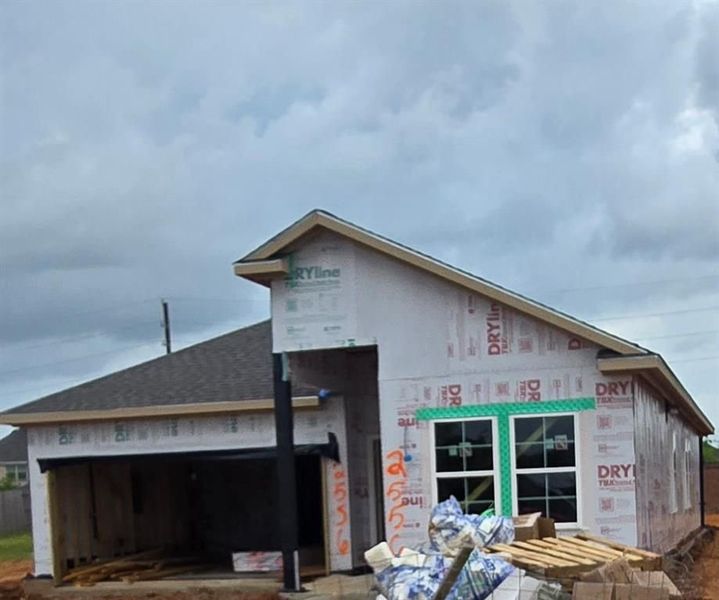 Front exterior of a new home in Sunterra, Katy, TX, highlighting curb appeal (Image 64). Front exterior of a new home in Sunterra, Katy, TX, highlighting curb appeal (Image 64).