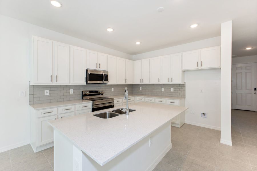 Representative furnished interior of a home built from the Madison by Park Square Residential in Townwalk at Babcock Ranch, Punta Gorda (Image 8).
