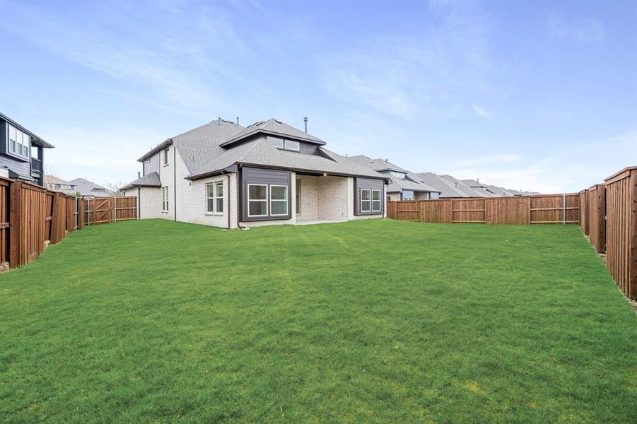 Exterior details and patio area of a home in Windsong Ranch Classic 61, Prosper (Image 28).