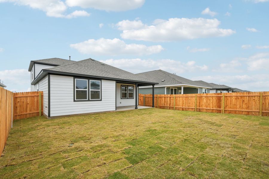 A house with a fence around it.