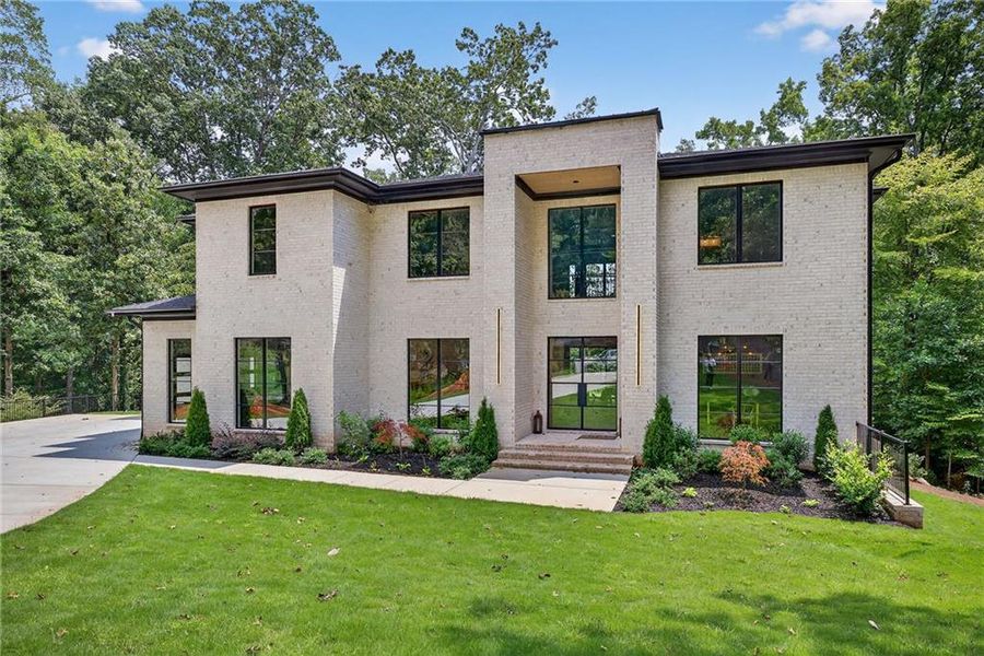Front exterior of a new home in , Brookhaven, GA, highlighting curb appeal (Image 1). Front exterior of a new home in , Brookhaven, GA, highlighting curb appeal (Image 1).