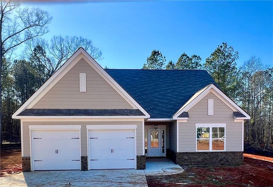 Front exterior of a new home in Waters Edge, Mansfield, GA, highlighting curb appeal (Image 1). Front exterior of a new home in Waters Edge, Mansfield, GA, highlighting curb appeal (Image 1).