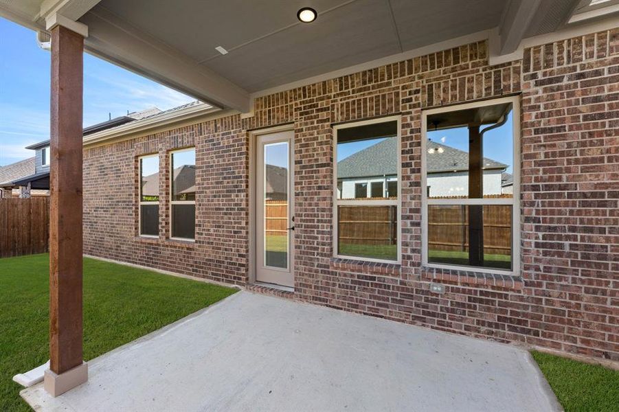 Exterior details and patio area of a home in Country Lakes, Argyle (Image 3).