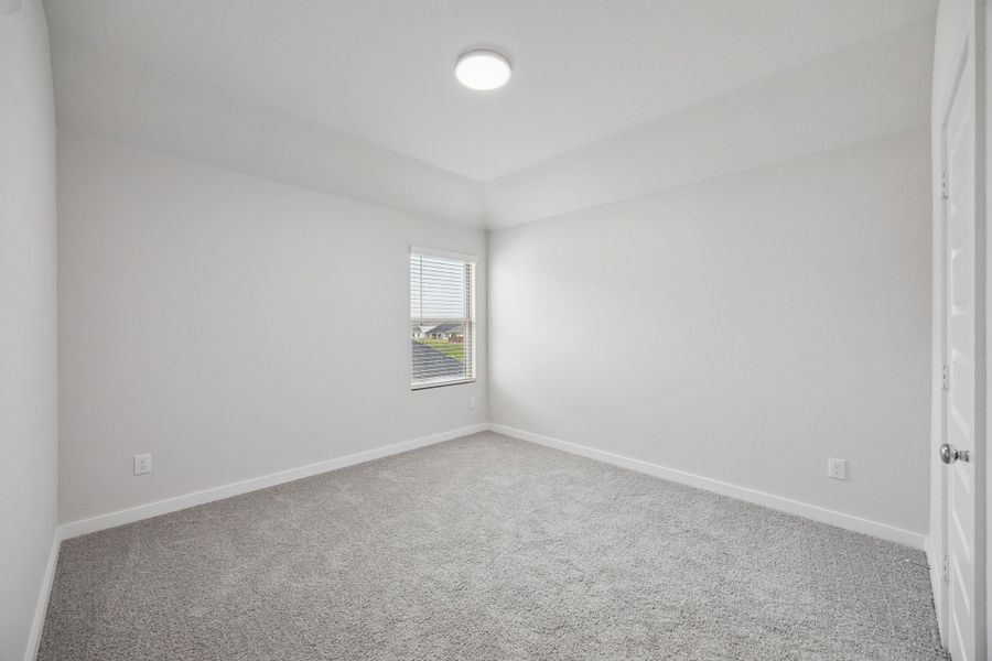 Bedroom in the Masters home plan by Trophy Signature Homes – REPRESENTATIVE PHOTO