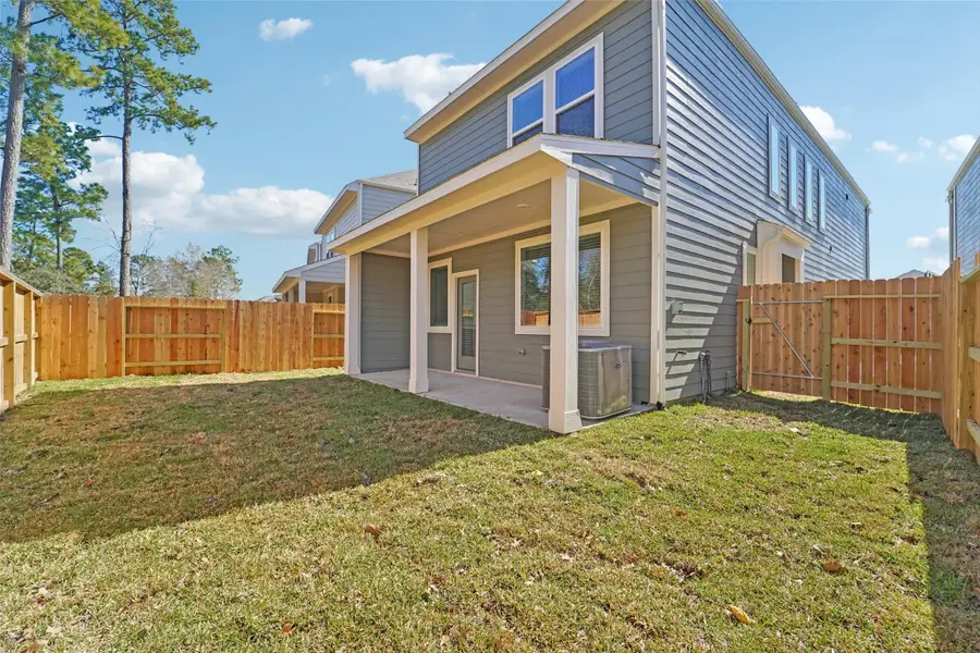 Exterior details and patio area of a home in Pinewood Trails - City Series, Atascocita (Image 3).
