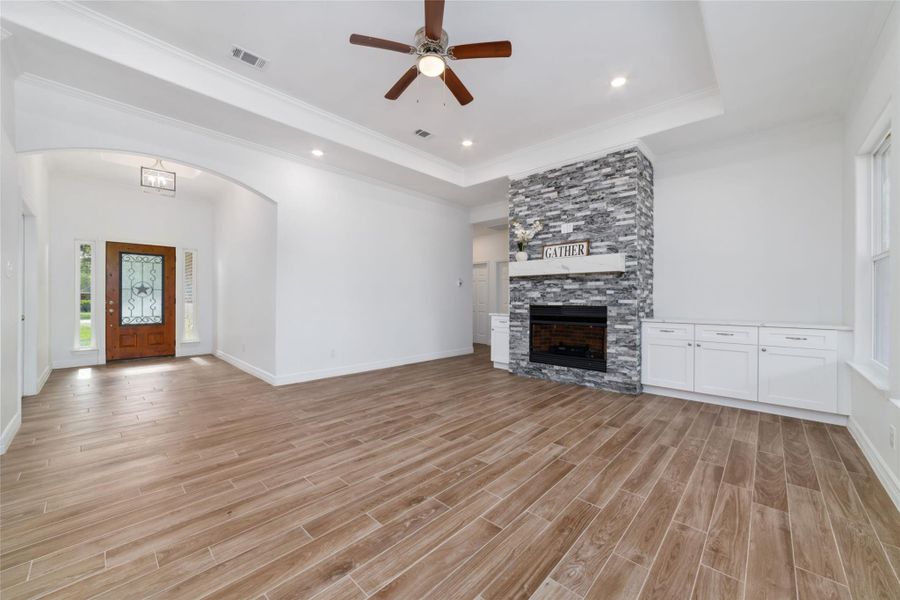 Spacious open floor plan with high ceilings. Gorgeous fireplace with stylish built-ins for added storage. Spacious open floor plan with high ceilings. Gorgeous fireplace with stylish built-ins for added storage.