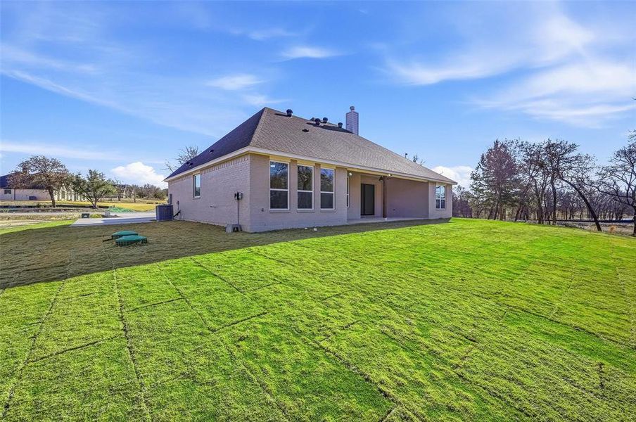 Exterior details and patio area of a home in Escondido Ranches, Poolville (Image 4).