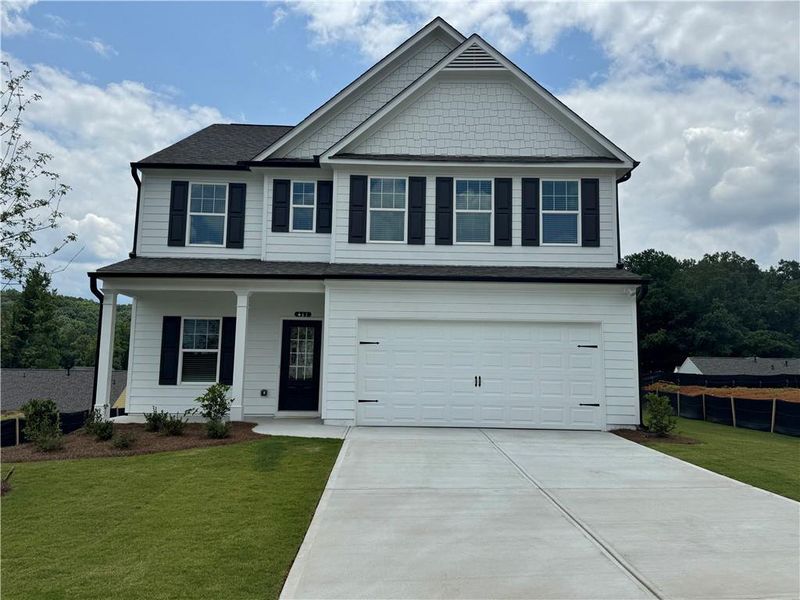 Front exterior of a new home in The Reserve at Willow Oaks, Canton, GA, highlighting curb appeal (Image 2). Front exterior of a new home in The Reserve at Willow Oaks, Canton, GA, highlighting curb appeal (Image 2).