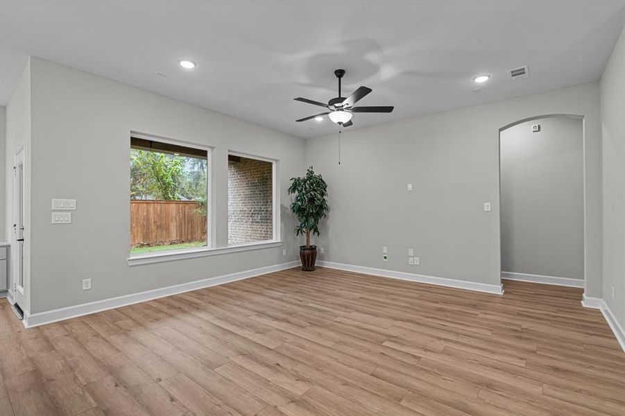 Large Living area with big windows overlooking fully sodded rear yard and covered patio