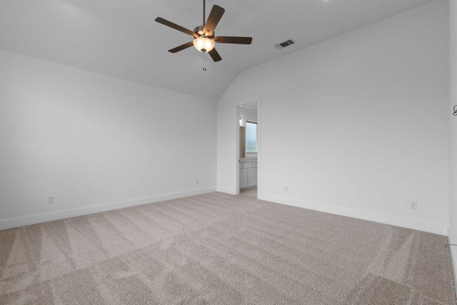 Primary Bedroom with elevated ceiling Primary Bedroom with elevated ceiling