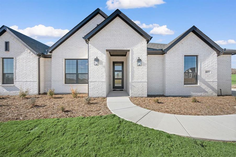 Front exterior of a new home in Rocky Top Ranch, Reno, TX, highlighting curb appeal (Image 21).