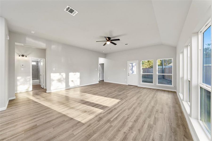 Looking into the living room with a view of the guest bathroom and bedrooms.