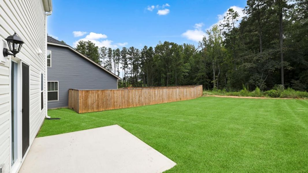 Exterior details and patio area of a home in Ravencrest, Roebuck (Image 21).