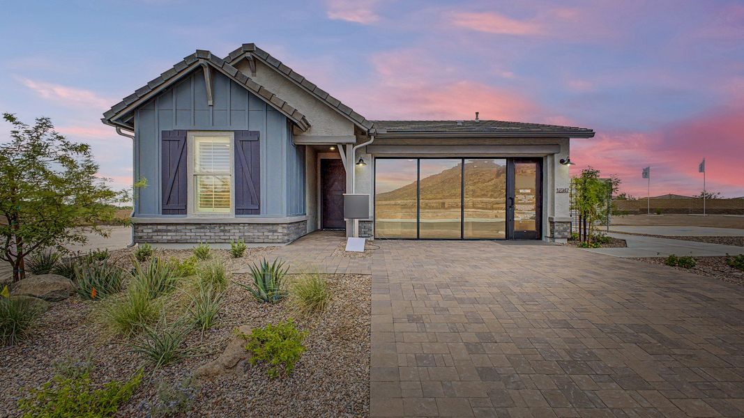 Representative exterior photo of a completed home built from the Clover by DRB Homes in The Lakes at Rancho El Dorado, Maricopa, AZ (Image 21). Representative exterior photo of a completed home built from the Clover by DRB Homes in The Lakes at Rancho El Dorado, Maricopa, AZ (Image 21).