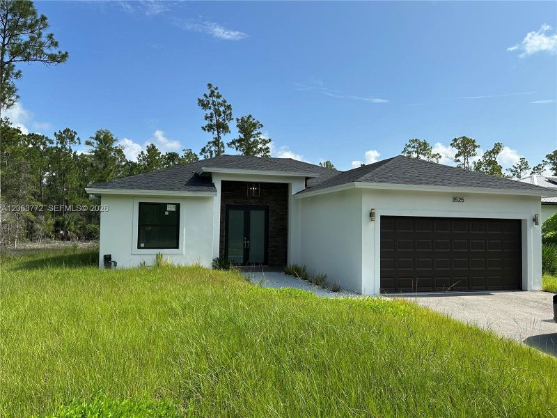 Front exterior of a new home in , Naples, FL, highlighting curb appeal (Image 19). Front exterior of a new home in , Naples, FL, highlighting curb appeal (Image 19).
