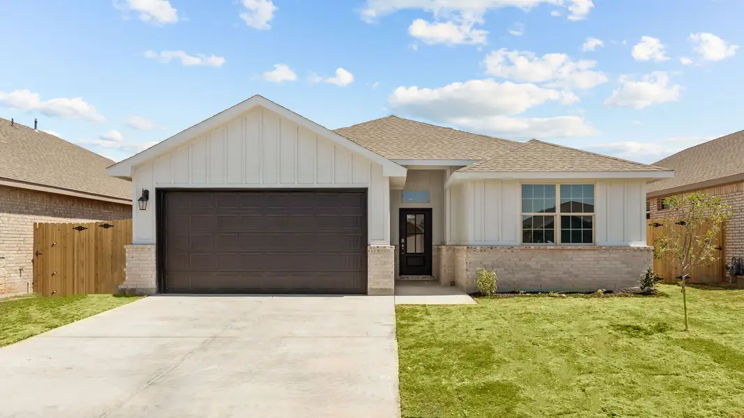 Representative exterior photo of a completed home built from the THE HOBBS by D.R. Horton in Northwest Passage, Midland, TX (Image 2). Representative exterior photo of a completed home built from the THE HOBBS by D.R. Horton in Northwest Passage, Midland, TX (Image 2).