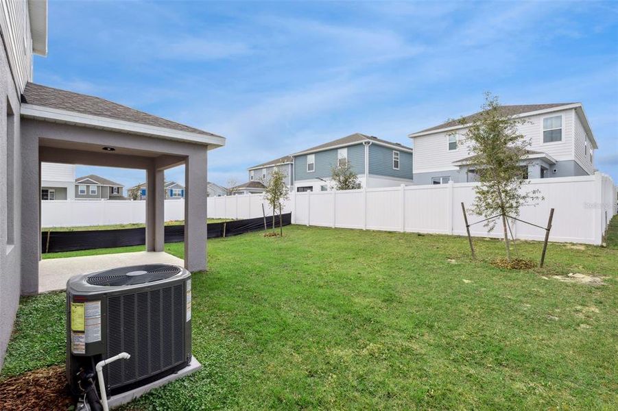 Exterior details and patio area of a home in Trinity Lakes, Groveland (Image 3).