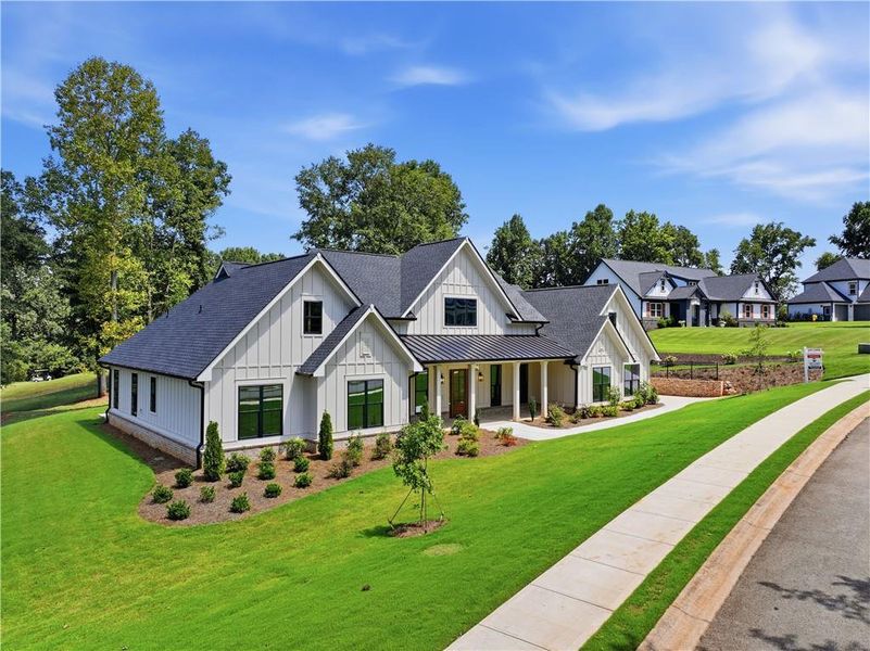 Front exterior of a new home in , Commerce, GA, highlighting curb appeal (Image 2). Front exterior of a new home in , Commerce, GA, highlighting curb appeal (Image 2).