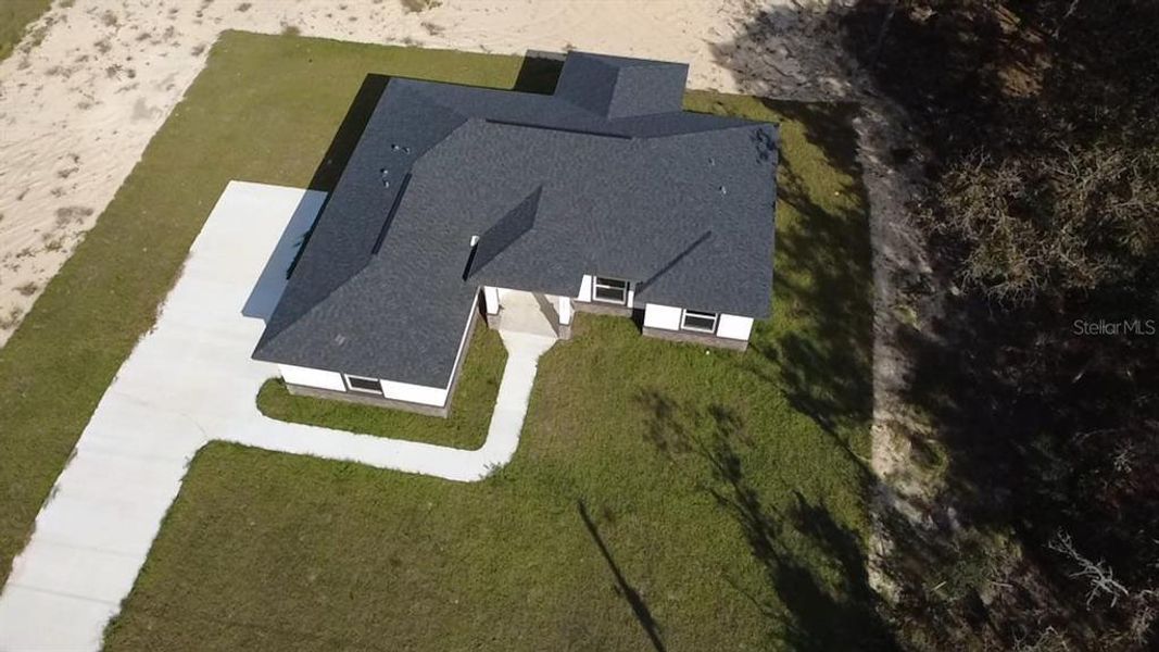 Front exterior of a new home in , Dunnellon, FL, highlighting curb appeal (Image 20).