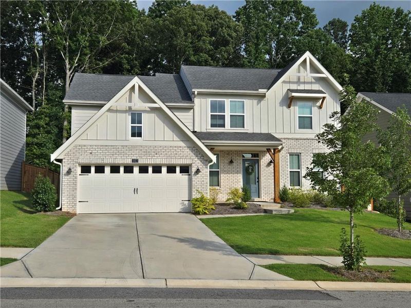 Front exterior of a new home in The Reserve At Liberty Park, Braselton, GA, highlighting curb appeal (Image 1).