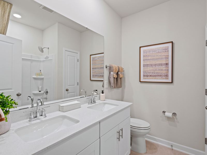 Furnished interior view inside a new home in Waterside - Coastline Series, Longs (Image 23).