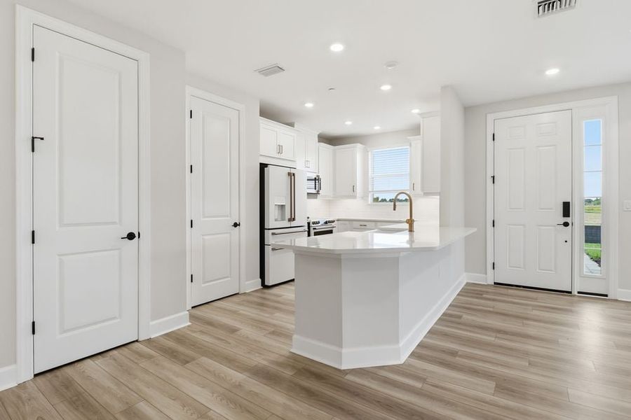 Furnished interior view inside a new home in Esplanade by the Islands Coach Homes, Naples (Image 5).