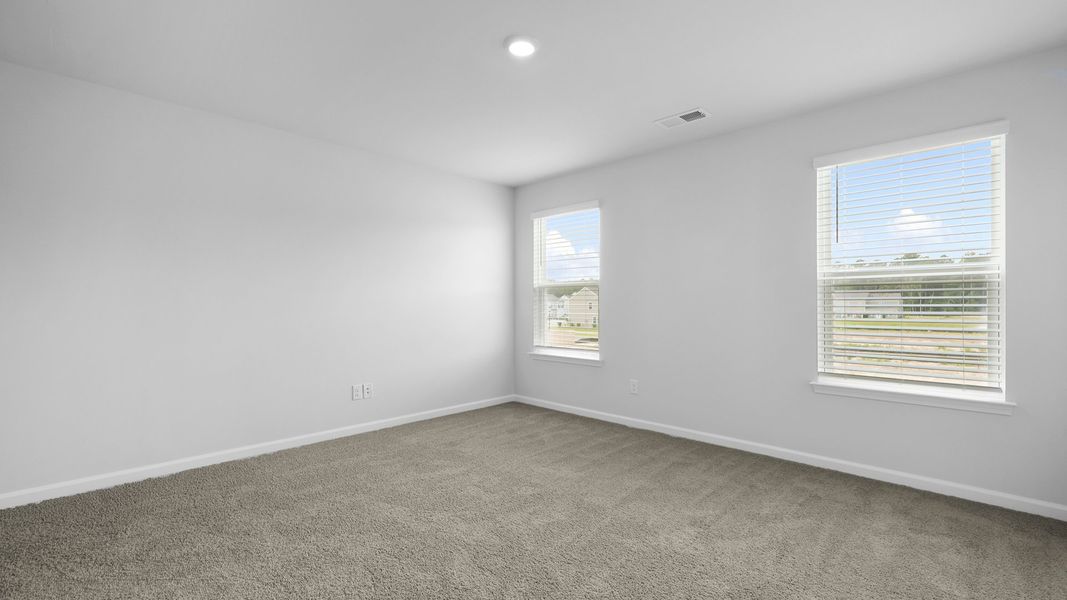 Representative unfurnished interior of a home built from the MURRAY TH by D.R. Horton in Pine Hills Townhomes at Cane Bay, Summerville (Image 32).