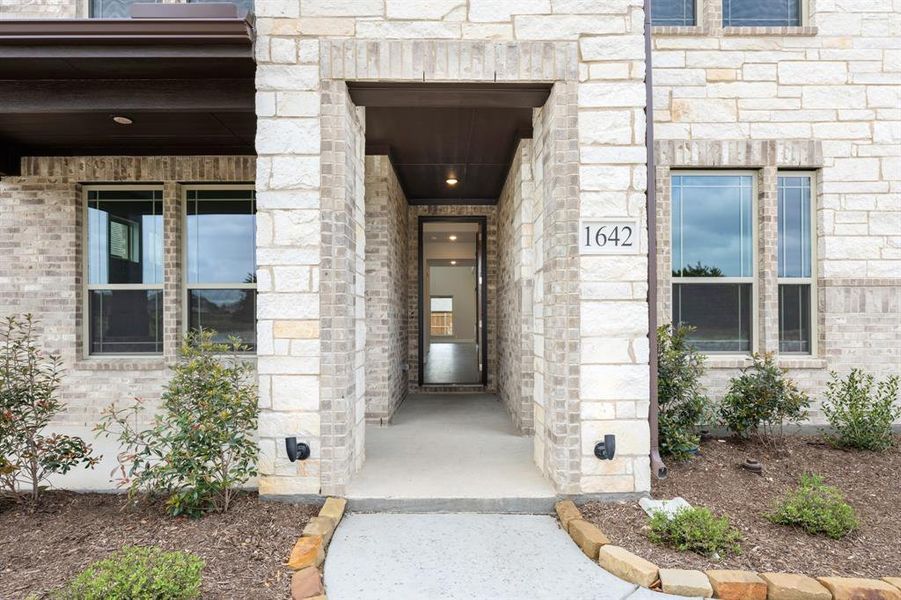 Exterior details and patio area of a home in Addison Hills, Cedar Hill (Image 24).