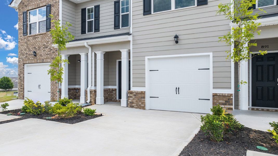 Front exterior of a new home in The Parish at Flat Rock Townhomes, Graniteville, SC, highlighting curb appeal (Image 18). Front exterior of a new home in The Parish at Flat Rock Townhomes, Graniteville, SC, highlighting curb appeal (Image 18).