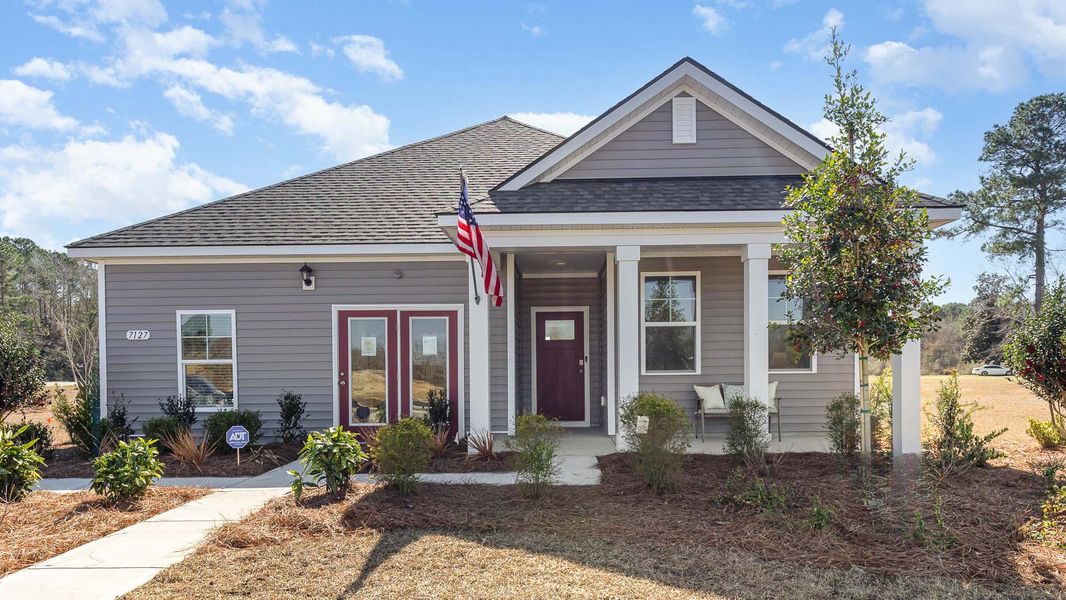 Front exterior of a new home in Sandpiper Place, Myrtle Beach, SC, highlighting curb appeal (Image 1). Front exterior of a new home in Sandpiper Place, Myrtle Beach, SC, highlighting curb appeal (Image 1).
