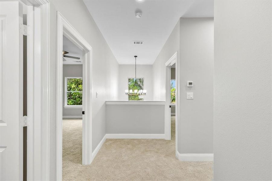 View of upstair entry and light fixture above foyer