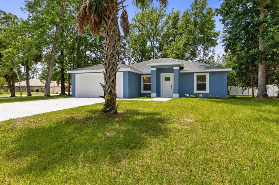 Front exterior of a new home in , Palm Coast, FL, highlighting curb appeal (Image 1). Front exterior of a new home in , Palm Coast, FL, highlighting curb appeal (Image 1).