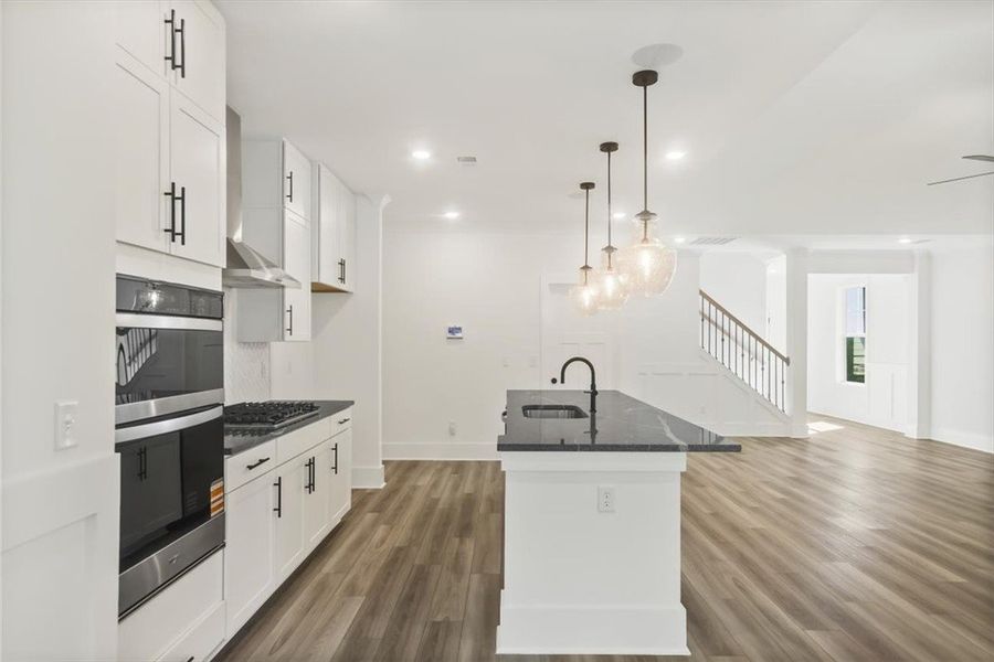 An open floorplan seamlessly connects the modern k