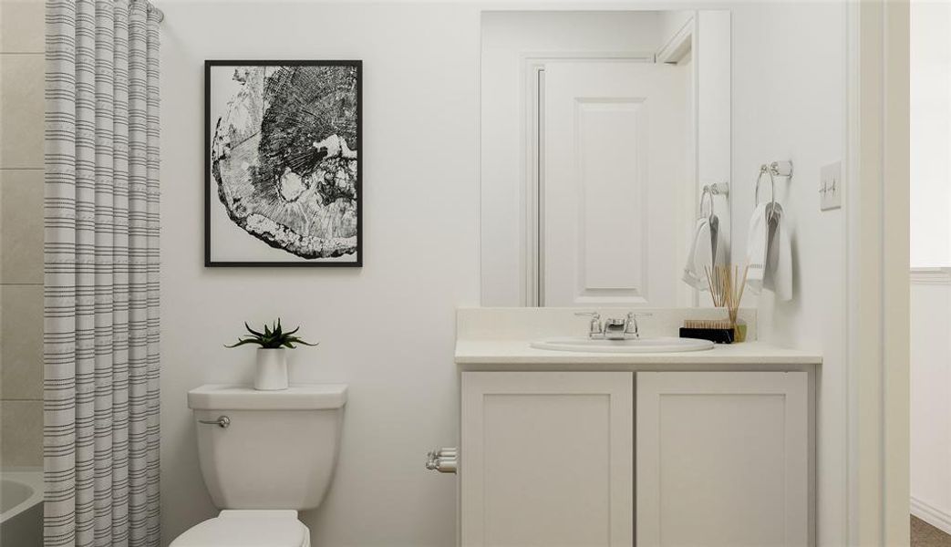 Full bathroom with toilet, shower / tub combo with curtain, and vanity