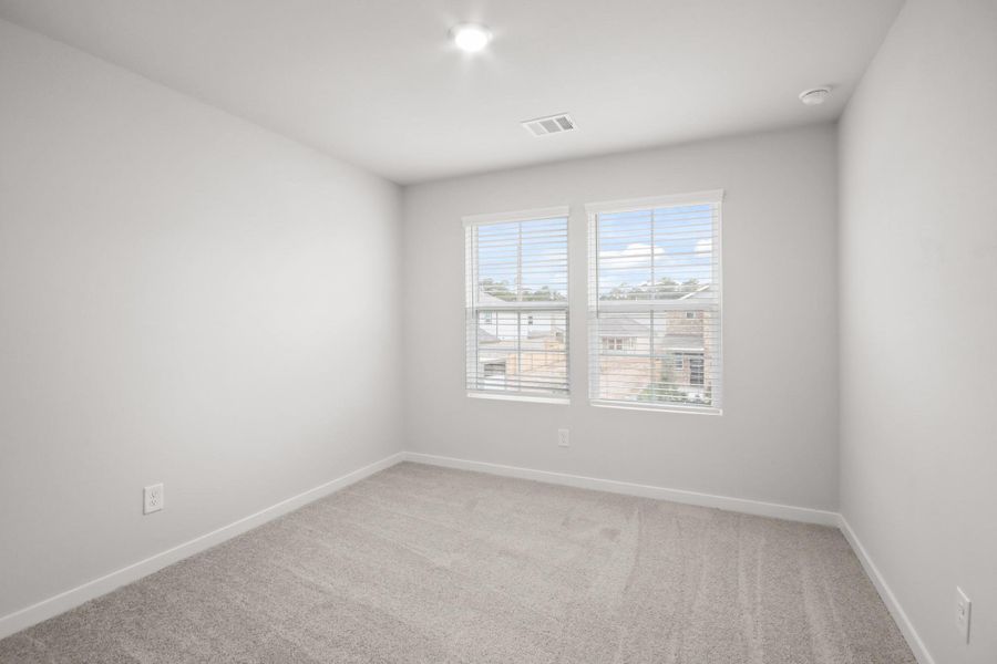 Spacious, unfurnished interior of a new home in Lakes at Black Oak, Magnolia (Image 15).