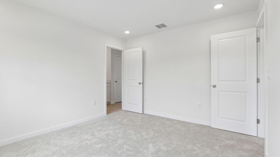 Furnished interior view inside a new home in Cyrene at Harmony, St. Cloud (Image 28).