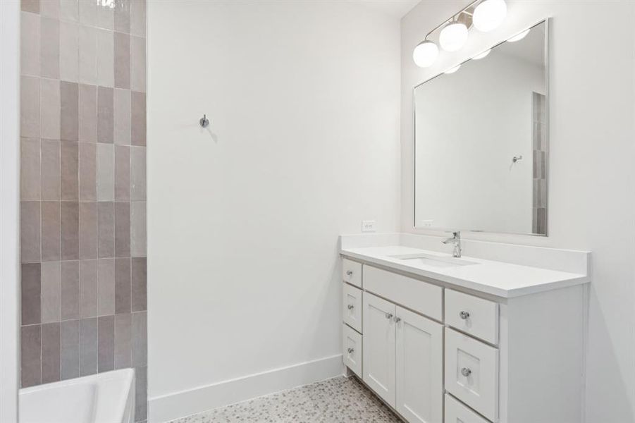 Bathroom with baseboards and vanity