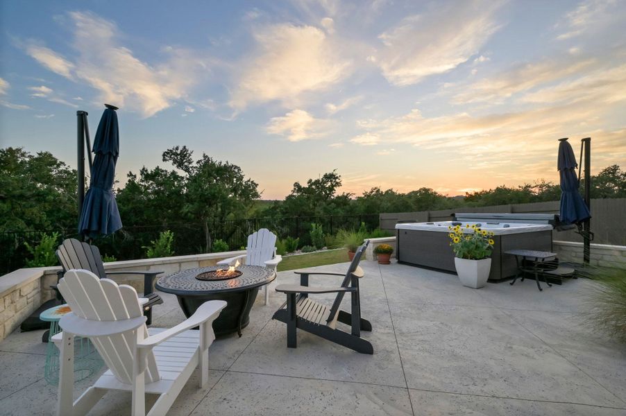 Evenings are best spent relaxing or entertaining on your custom extended back patio as you enjoy awe-inspiring sunsets, soak in the hot tub, prepare dinner for friends and family in your outdoor kitchen, or locate the Milky Way in this dark-sky community Evenings are best spent relaxing or entertaining on your custom extended back patio as you enjoy awe-inspiring sunsets, soak in the hot tub, prepare dinner for friends and family in your outdoor kitchen, or locate the Milky Way in this dark-sky community