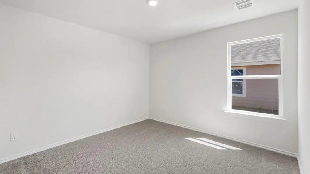 Room featuring light gray carpeting, white baseboards, and a single recessed ceiling light fixture
