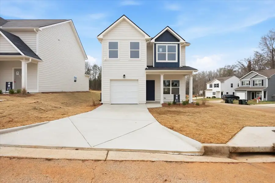 Front exterior of a new home in Creekside Manor, Thomaston, GA, highlighting curb appeal (Image 2). Front exterior of a new home in Creekside Manor, Thomaston, GA, highlighting curb appeal (Image 2).