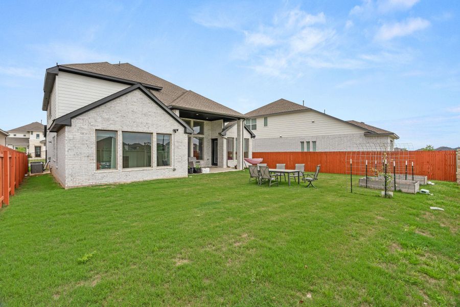 Exterior details and patio area of a home in Santa Rita Ranch, Liberty Hill (Image 23).