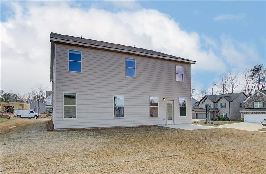 Exterior details and patio area of a home in Berkeley Lakes, Locust Grove (Image 18).
