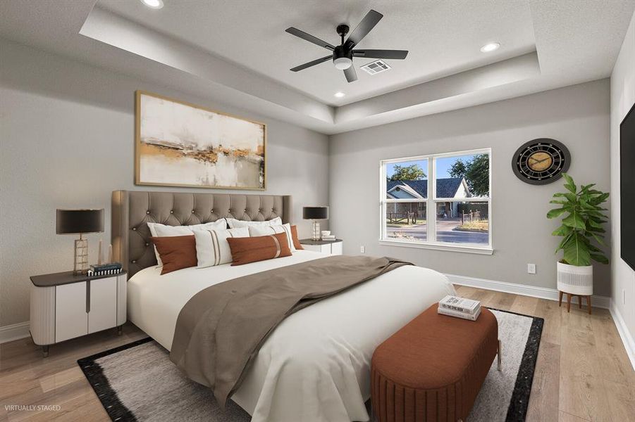 Bedroom with light wood-type flooring, a raised ceiling, recessed lighting, and ceiling fan Bedroom with light wood-type flooring, a raised ceiling, recessed lighting, and ceiling fan