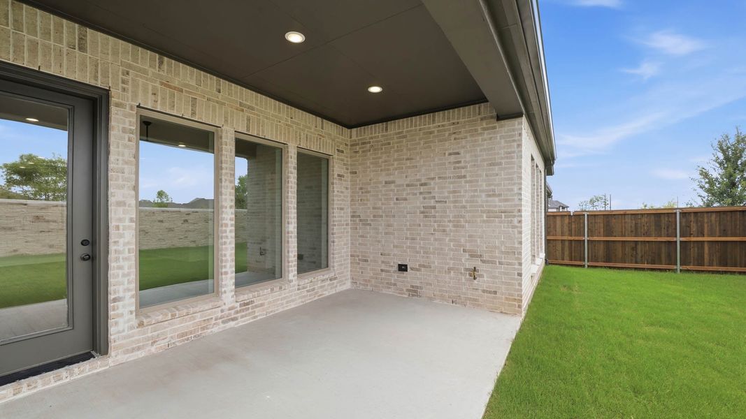 Exterior details and patio area of a home in Trinity Falls, McKinney (Image 4). Exterior details and patio area of a home in Trinity Falls, McKinney (Image 4).