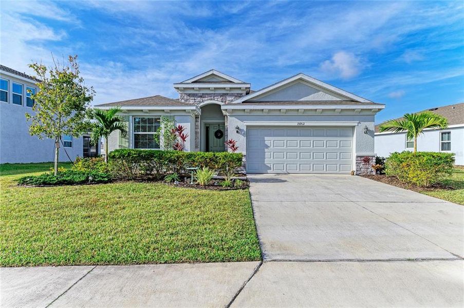 Front exterior of a new home in Coddington, Bradenton, FL, highlighting curb appeal (Image 1). Front exterior of a new home in Coddington, Bradenton, FL, highlighting curb appeal (Image 1).
