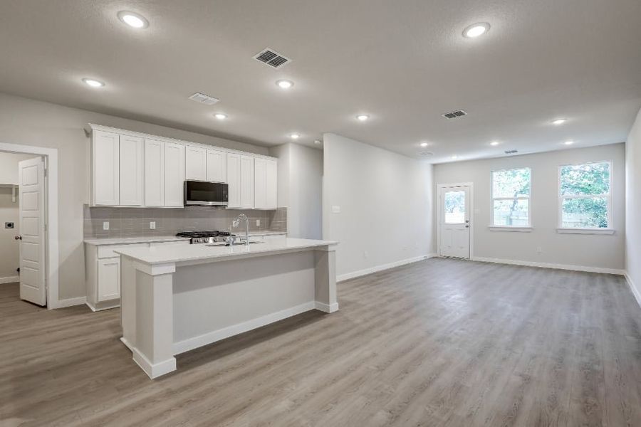 A kitchen with white cabinets. A kitchen with white cabinets.